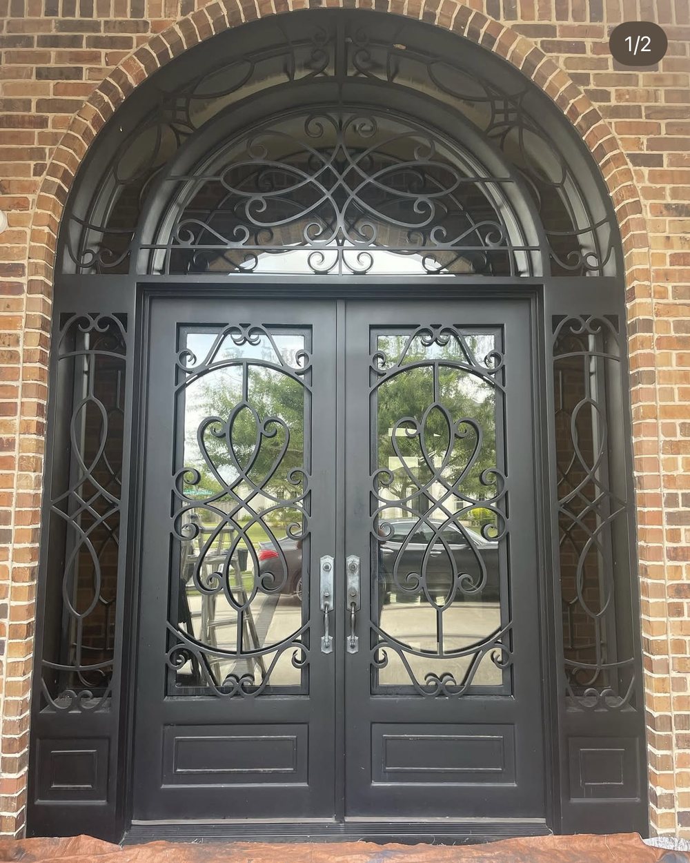 Double iron doors before — worn