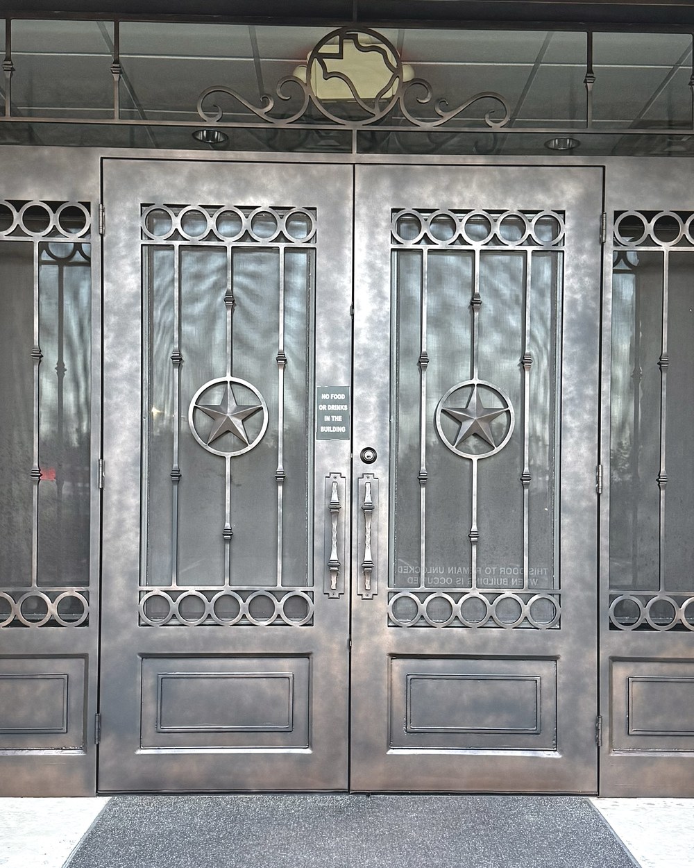 Wrought iron double doors with Texas stars after — refinished